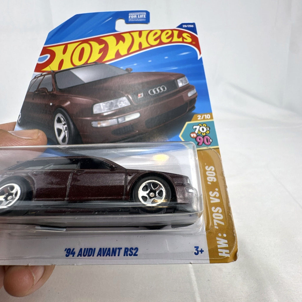 Hot Wheels 1994 Audi Avant RS2 1:64 diecast wagon in dark metallic brown sealed on original card