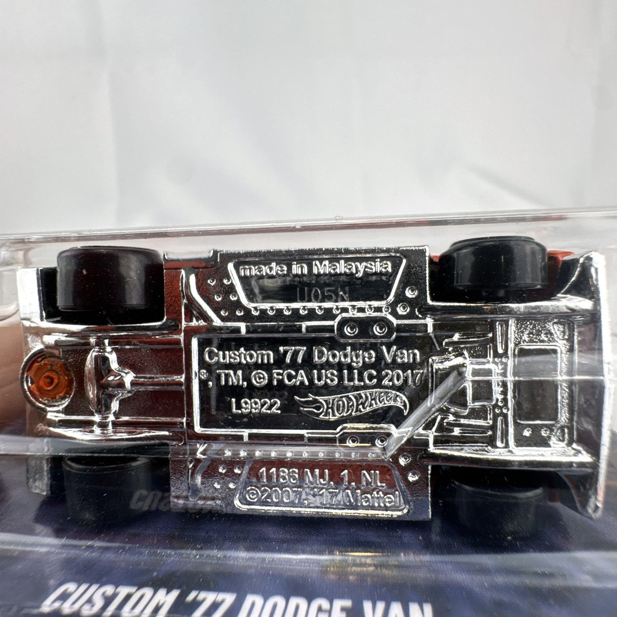 Hot Wheels Custom '77 Dodge Van 1:64 diecast in orange from the Surf's Up Silver Series, sealed on card