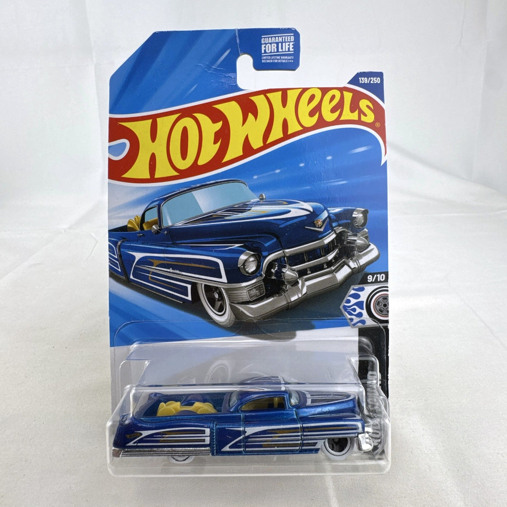 Hot Wheels 1:64 scale Custom '53 Cadillac diecast car in metallic blue on original sealed card