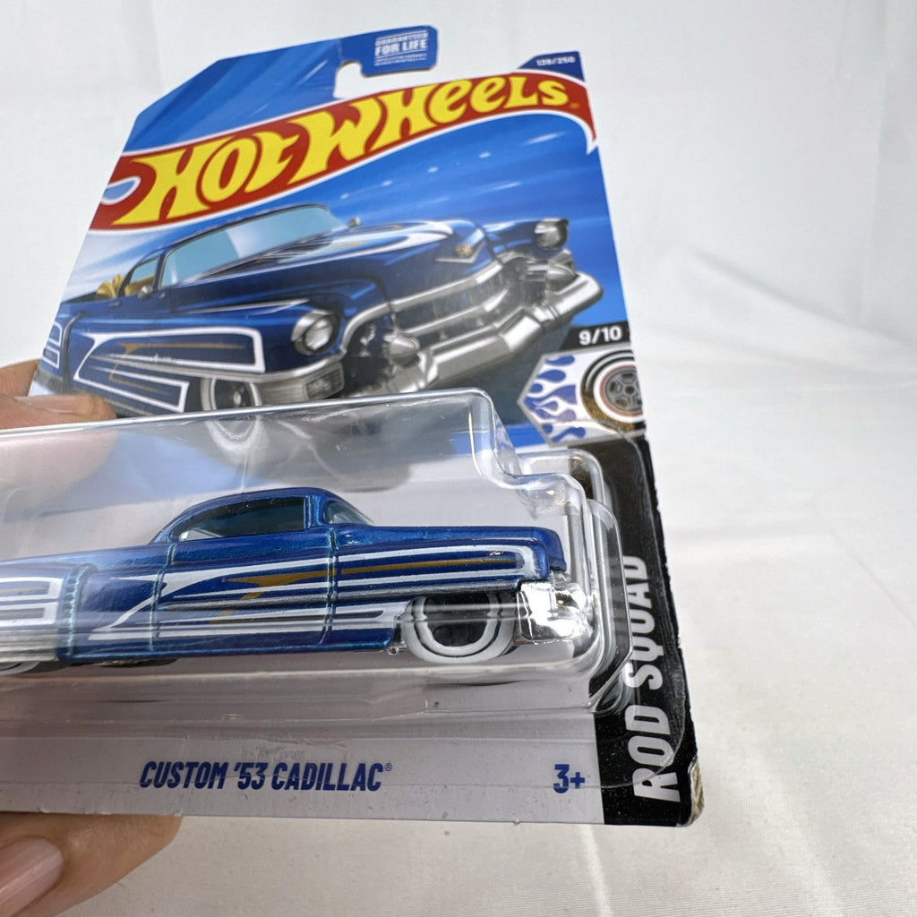 Hot Wheels 1:64 scale Custom '53 Cadillac diecast car in metallic blue on original sealed card