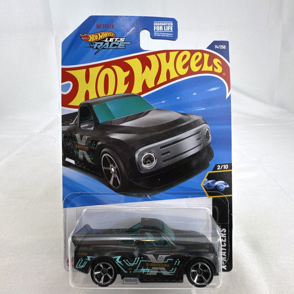 Hot Wheels Draftnator 1:64 scale black translucent diecast pickup truck in sealed X-Raycers packaging.