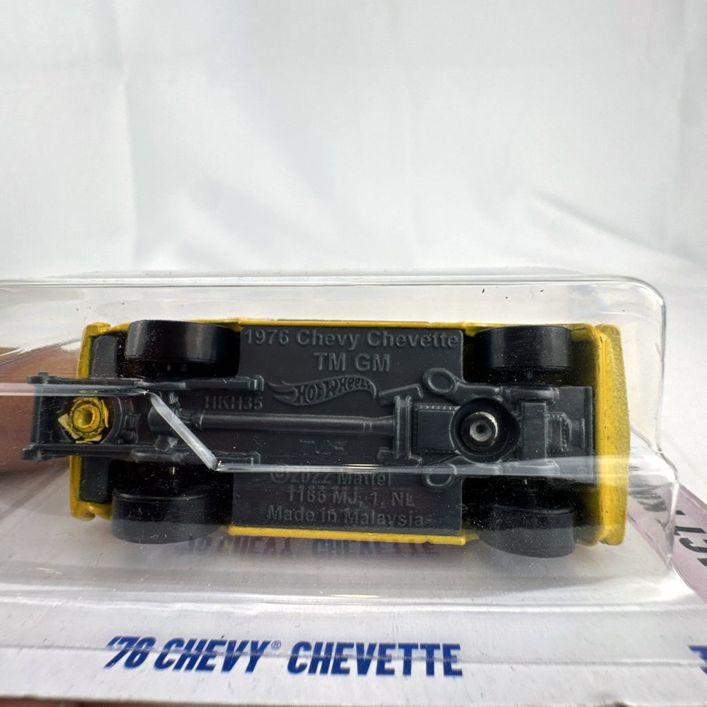Hot Wheels 1:64 scale 1976 Chevy Chevette NHRA Dragster diecast car in yellow, unopened packaging.