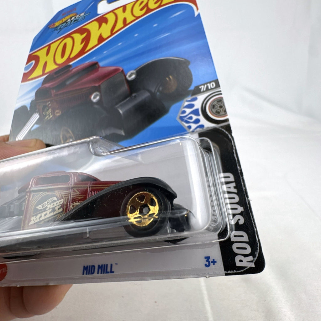 Hot Wheels 2024 Mid Mill 1:64 scale diecast car in dark red with gold graphics, factory sealed on Rod Squad card.