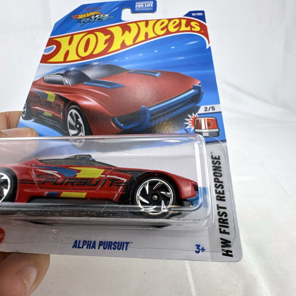 Red Hot Wheels 1:64 scale Alpha Pursuit diecast vehicle in factory-sealed HW First Response blister pack.