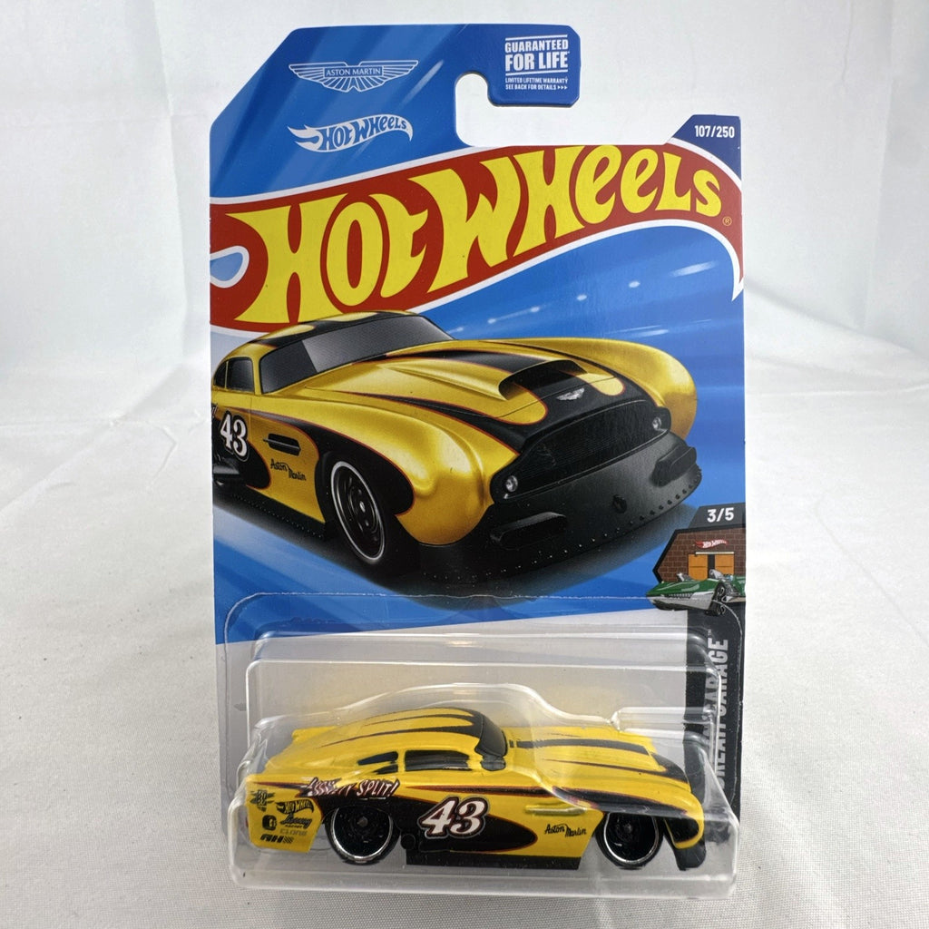 Hot Wheels 1:64 scale yellow Aston Martin DB4GT High-Speed Edition diecast car sealed in original packaging.