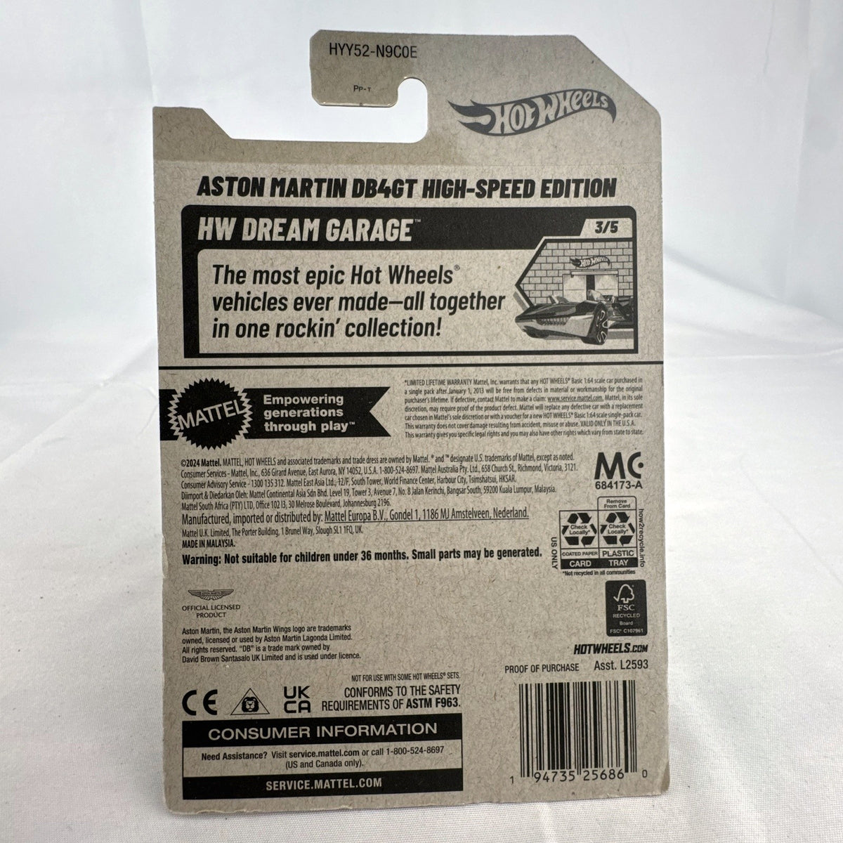 Hot Wheels 1:64 scale yellow Aston Martin DB4GT High-Speed Edition diecast car sealed in original packaging.