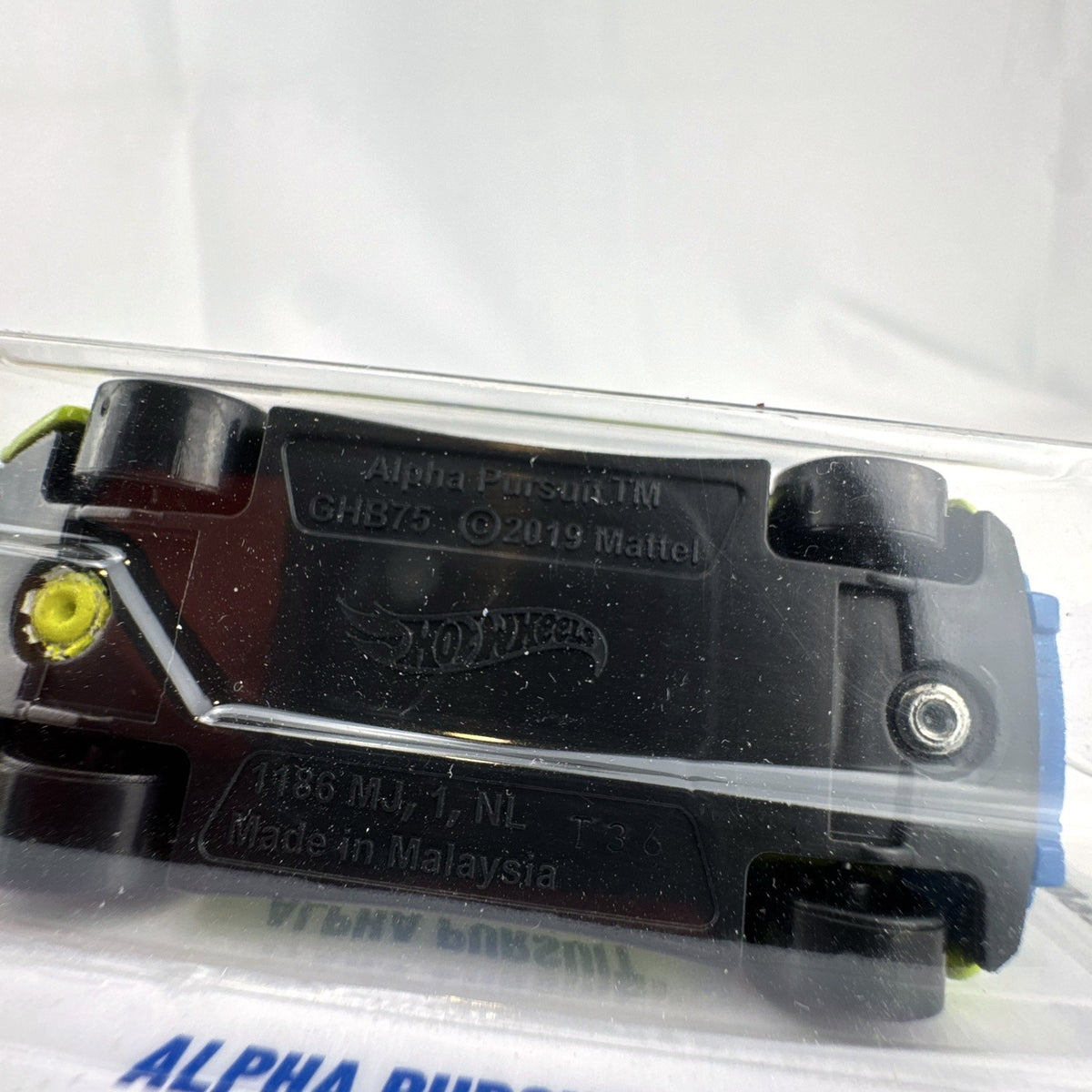 Factory sealed 2024 Hot Wheels Alpha Pursuit 1:64 scale diecast car in lime yellow on original card