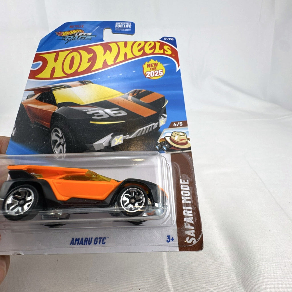 Hot Wheels 1:64 scale Amaru GTC diecast car in orange and black Safari Mode packaging