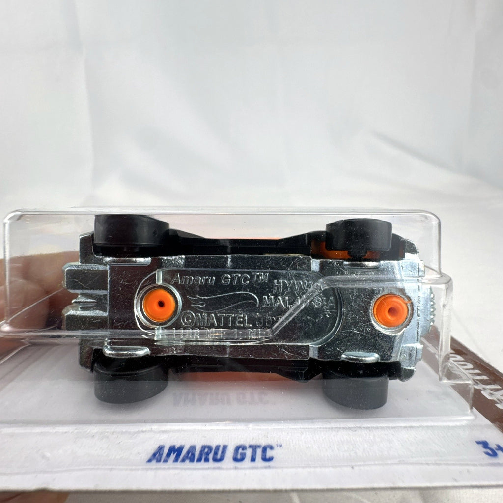 Hot Wheels 1:64 scale Amaru GTC diecast car in orange and black Safari Mode packaging