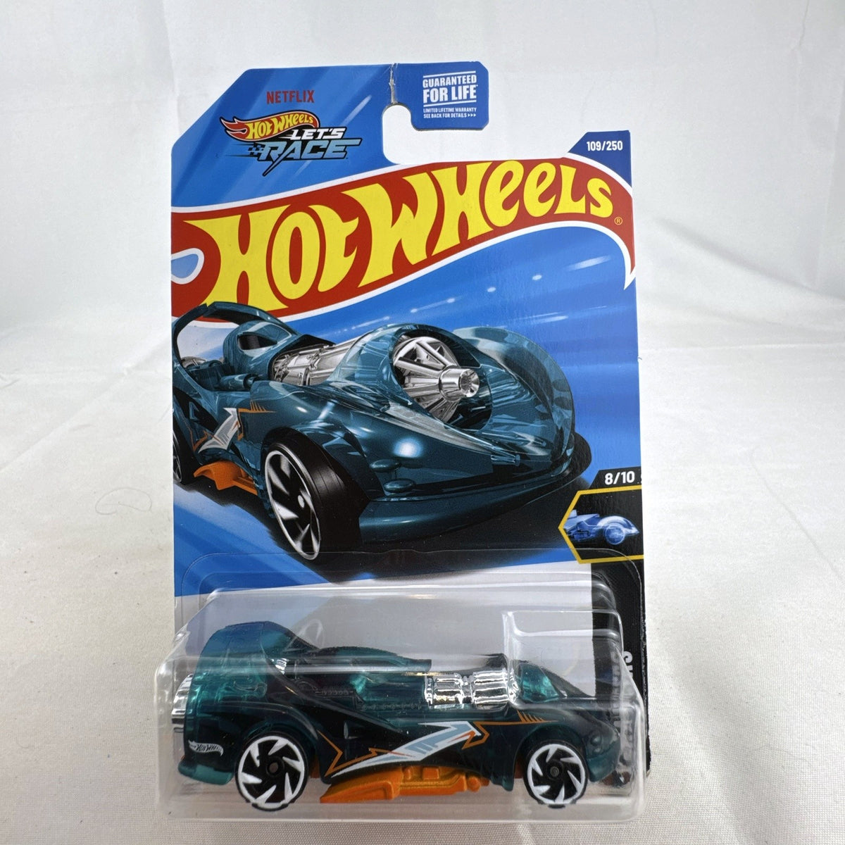 Sealed 2024 Hot Wheels Power Rocket 1:64 scale diecast car in translucent teal blue X-Raycers blister card packaging.