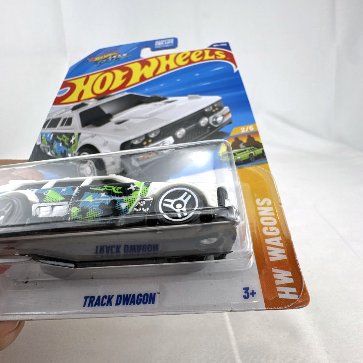 Hot Wheels 2024 HW Wagons Track Dwagon 1:64 scale white diecast car sealed in original card packaging.