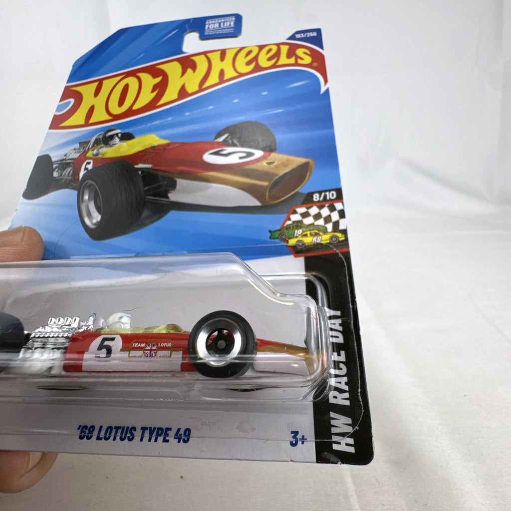Hot Wheels 1:64 scale diecast 1968 Lotus Type 49 F1 race car in red Team Lotus livery, factory sealed on card.
