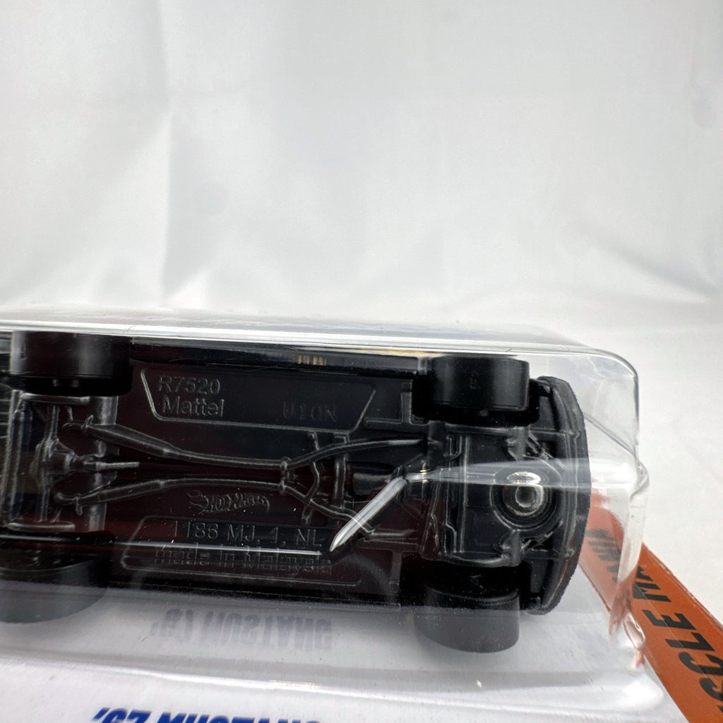 Hot Wheels 1:64 scale 1967 Ford Mustang diecast car in black from the Muscle Mania series