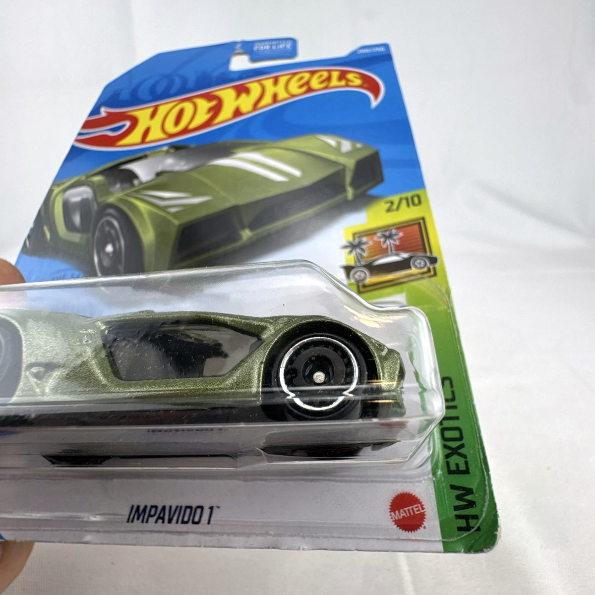 Sealed Hot Wheels Impavido 1 diecast car in metallic green with white stripes, 1:64 scale HW Exotics series.