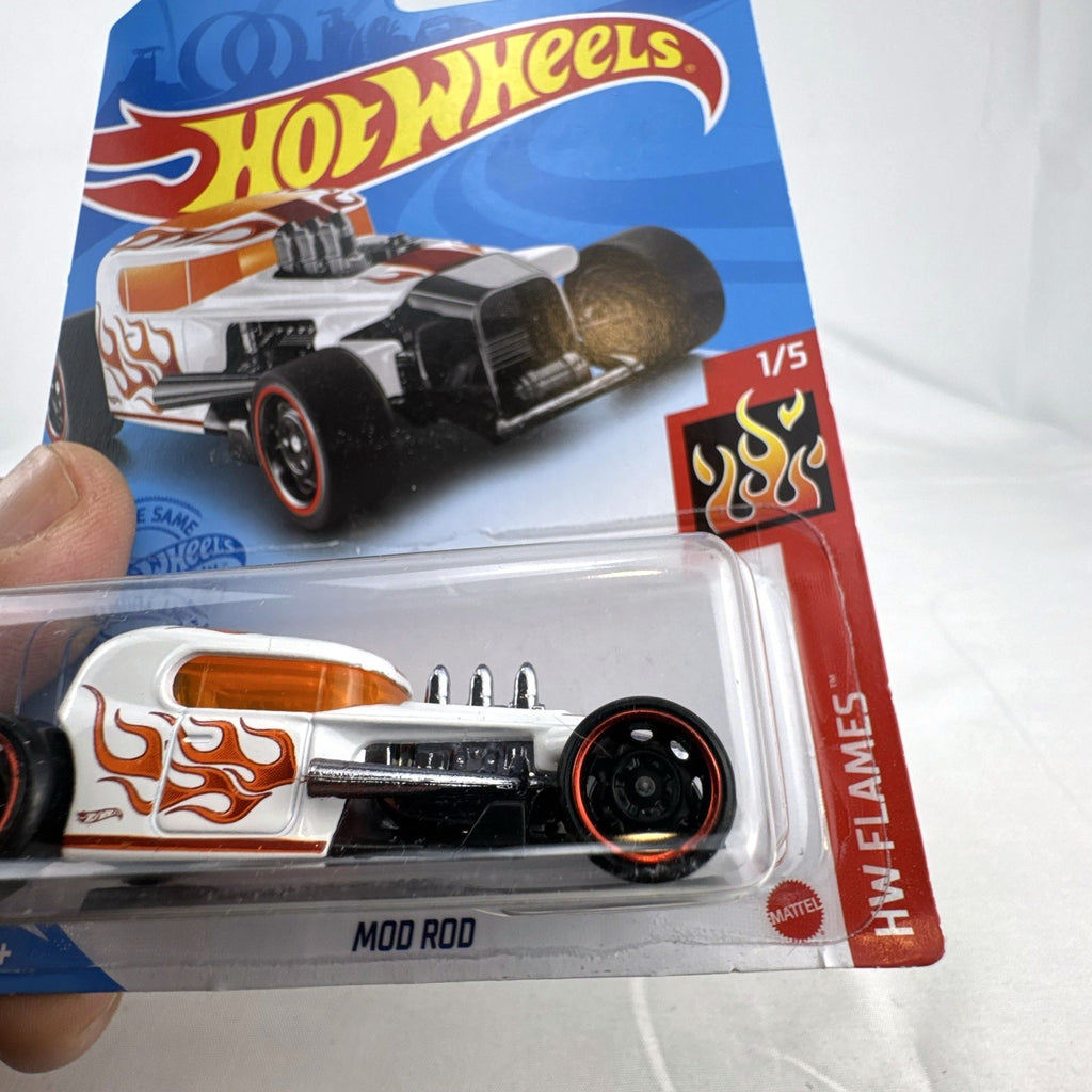 Factory sealed Hot Wheels Mod Rod 1:64 diecast car in white with orange HW Flames graphics on original card.