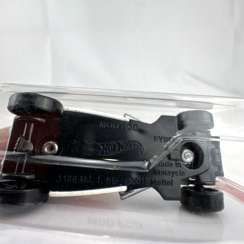 Factory sealed Hot Wheels Mod Rod 1:64 diecast car in white with orange HW Flames graphics on original card.