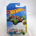 Hot Wheels 1:64 scale Rocket Oil Special diecast car in orange paint splatter from the HW Art Cars series on original card