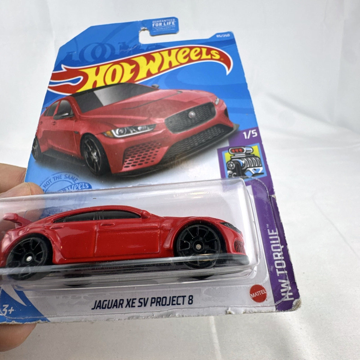 Hot Wheels 1:64 scale Jaguar XE SV Project 8 diecast car in red sealed on original HW Torque packaging card.