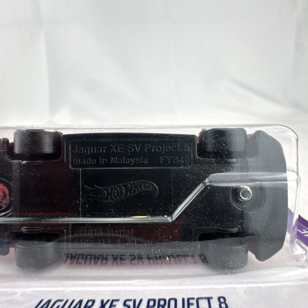Hot Wheels 1:64 scale Jaguar XE SV Project 8 diecast car in red sealed on original HW Torque packaging card.