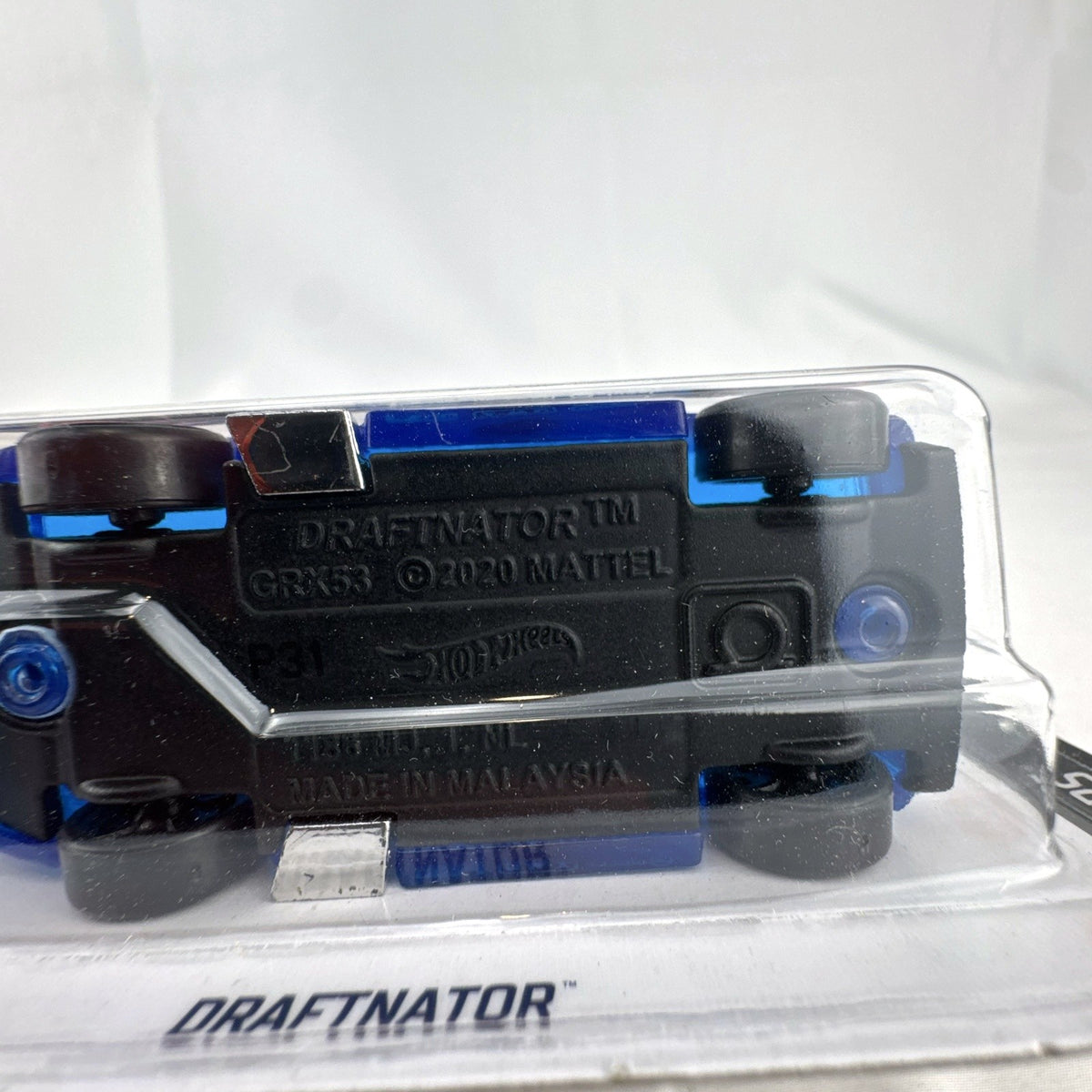 Hot Wheels 2021 Draftnator 1:64 diecast racing truck in translucent blue sealed on original packaging card