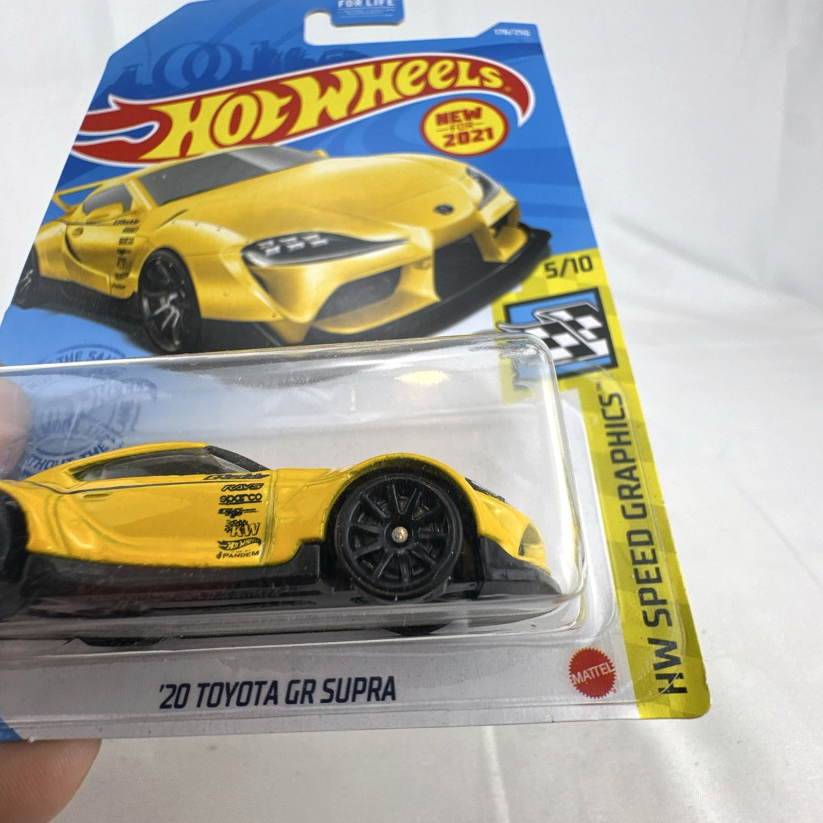 Hot Wheels 1:64 scale 2020 Toyota GR Supra diecast car in yellow, factory sealed on HW Speed Graphics card