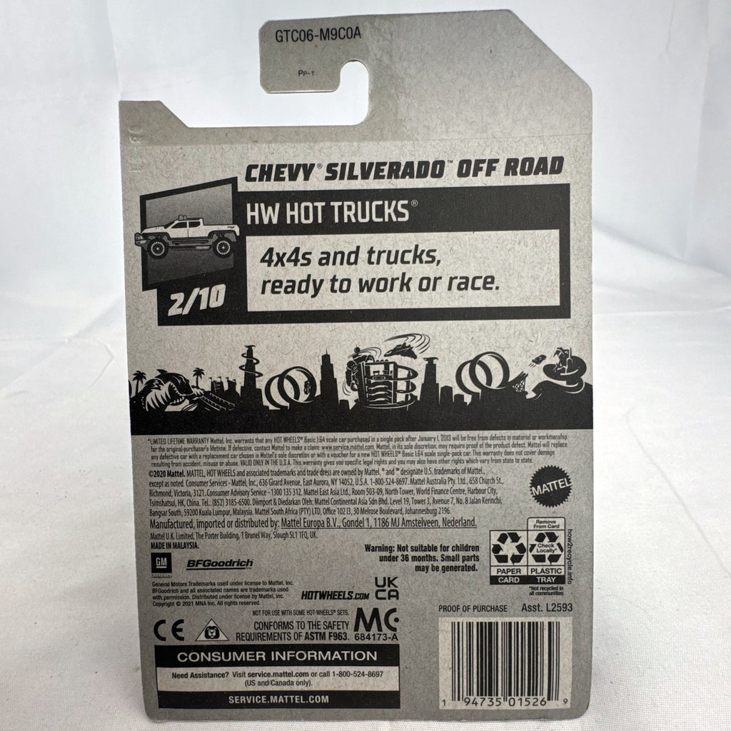 Hot Wheels 1:64 scale Chevy Silverado Off Road diecast truck in yellow, sealed on original blister card