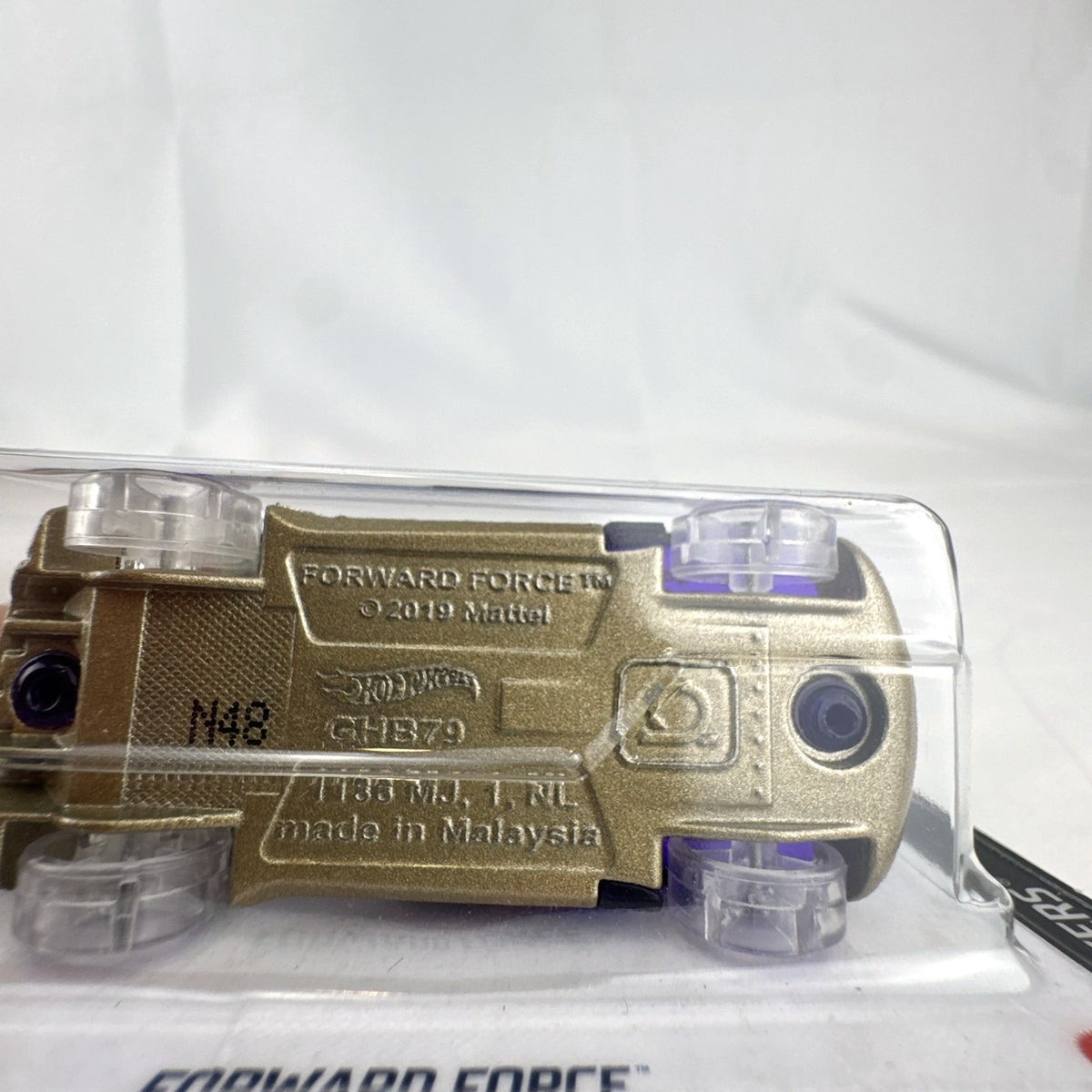 Hot Wheels 1:64 scale Forward Force diecast car in translucent purple from the X-Raycers series in original packaging.