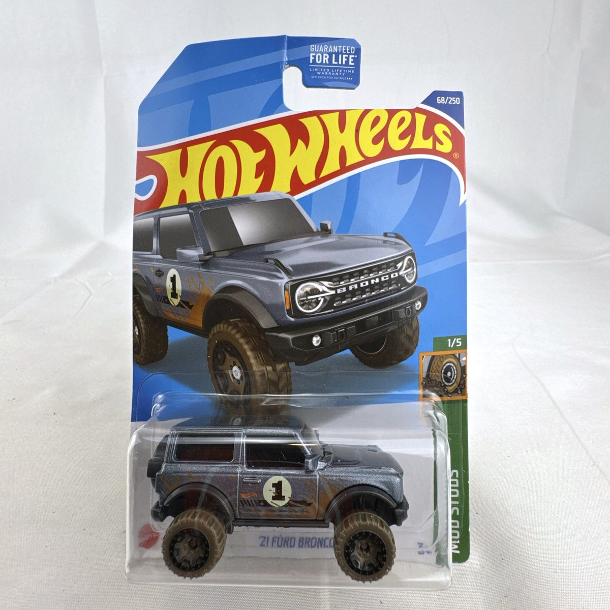 Hot Wheels 2021 Ford Bronco diecast SUV in gray with Mud Studs off-road graphics sealed on blister card