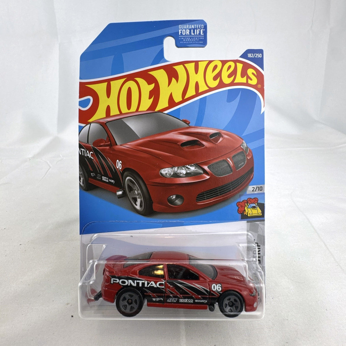 Hot Wheels 1:64 scale red '06 Pontiac GTO HW Drag Strip series diecast car in factory sealed blister package