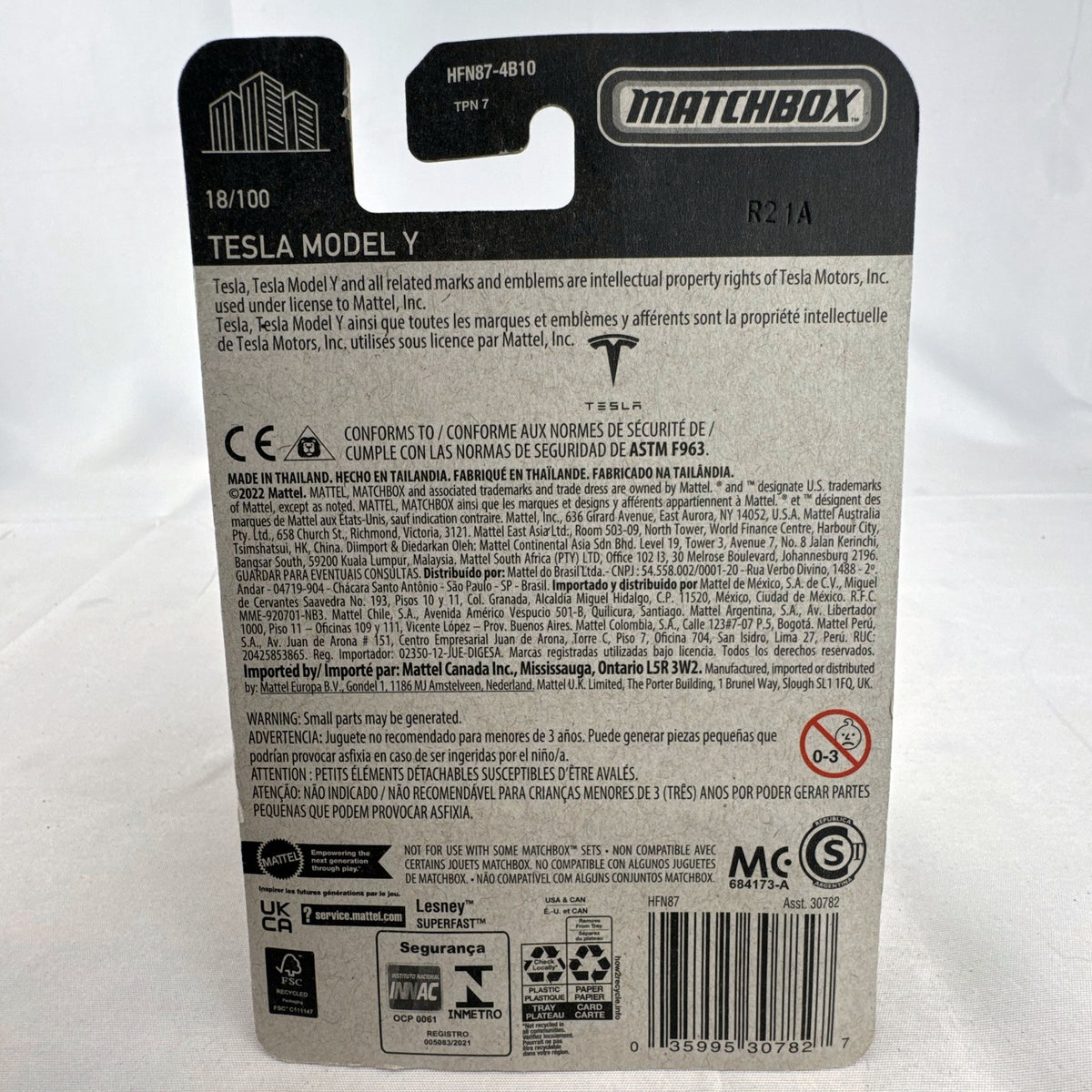 Matchbox 1:64 scale Tesla Model Y diecast toy car in deep metallic red, factory sealed on original card.