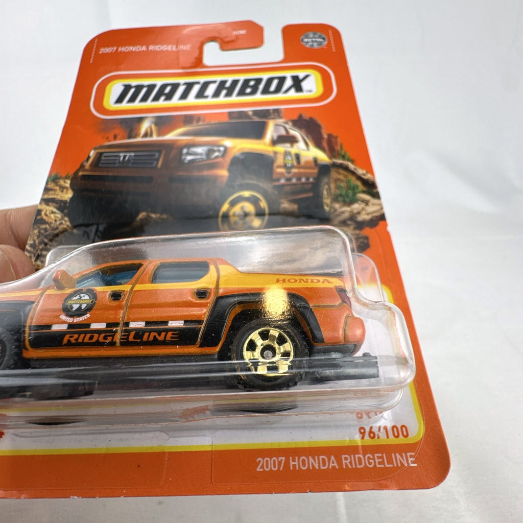Matchbox 2007 Honda Ridgeline 1:64 scale diecast pickup truck in orange, factory sealed on card
