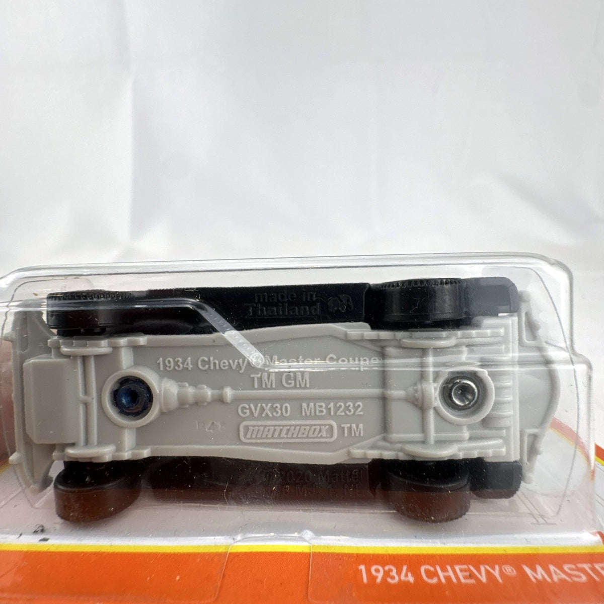 Matchbox 1:64 scale 1934 Chevrolet Master Coupe diecast car in dark blue, factory sealed on original card.