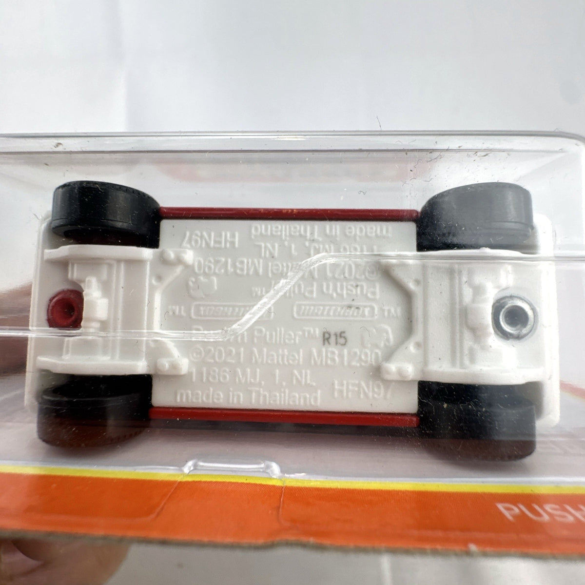 Red Matchbox Push 'N Puller 1:64 scale diecast truck with shark mouth graphics, sealed in original packaging.