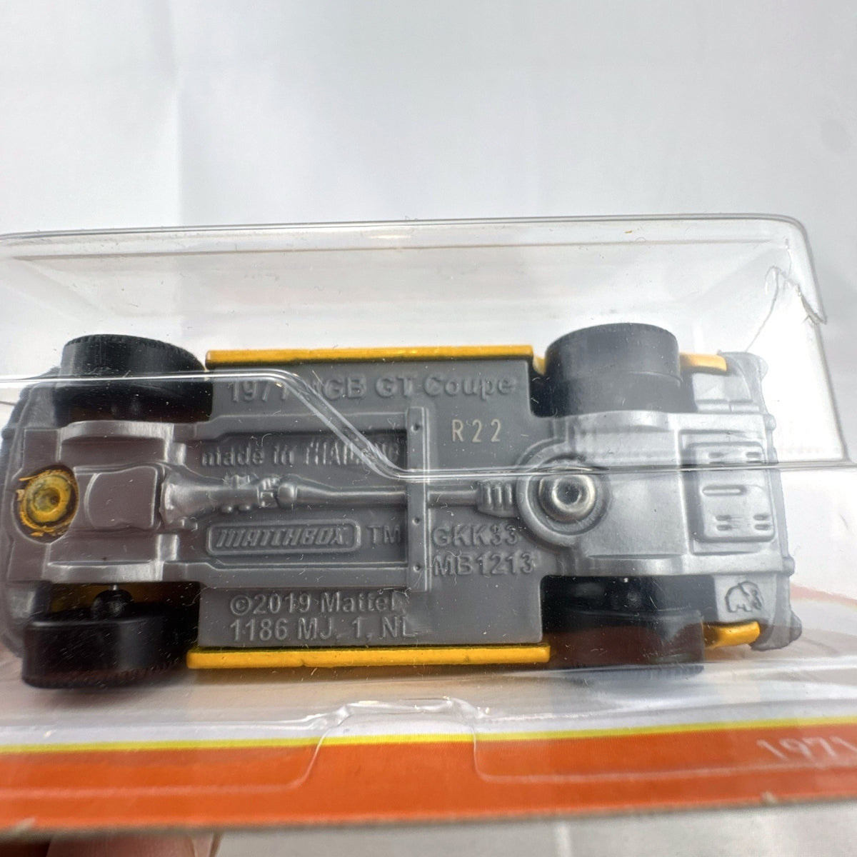 Yellow Matchbox 1:64 scale 1971 MGB GT Coupe diecast car sealed on original blister card.