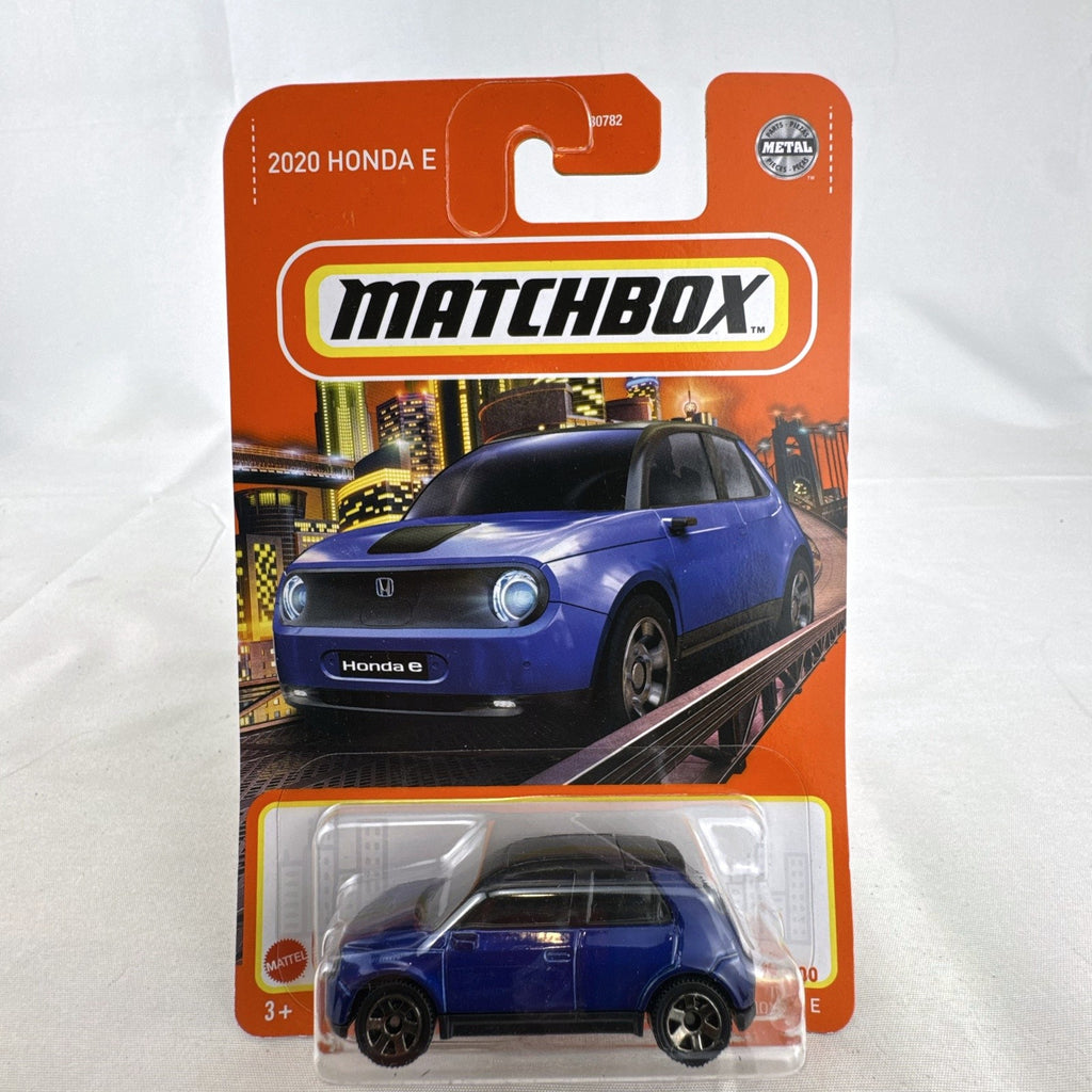 Matchbox 1:64 scale diecast model of a blue 2020 Honda e EV in original unopened blister card packaging.