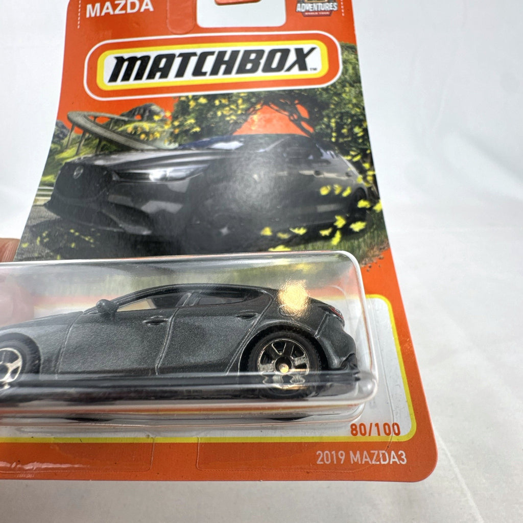 Matchbox 2019 Mazda3 Hatchback diecast car in dark metallic gray 1:64 scale unopened packaging