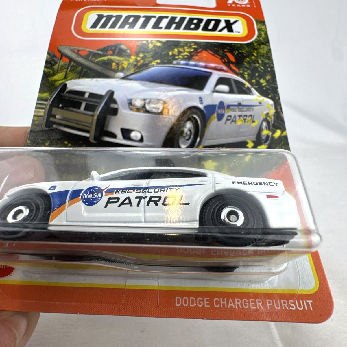 Matchbox 70th Anniversary 1:64 diecast Dodge Charger Pursuit with white NASA KSC Security Patrol livery in blister pack