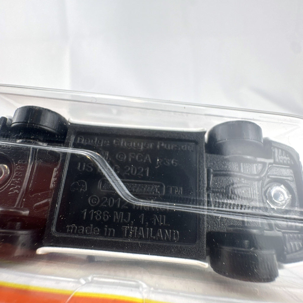 Matchbox 70th Anniversary 1:64 diecast Dodge Charger Pursuit with white NASA KSC Security Patrol livery in blister pack