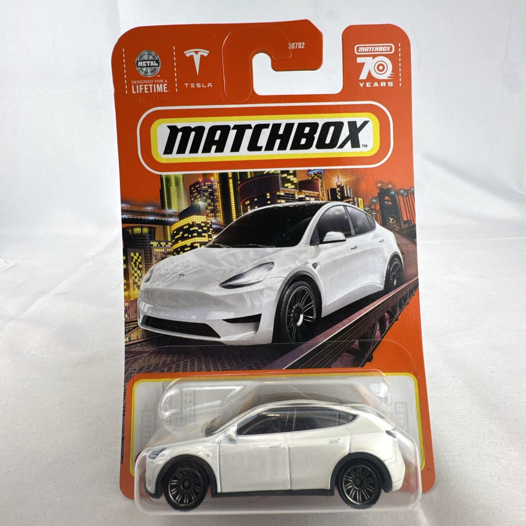 Sealed Matchbox 1:64 scale Tesla Model Y diecast car in white from the 70th Anniversary collection number 89/100