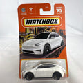 Sealed Matchbox 1:64 scale Tesla Model Y diecast car in white from the 70th Anniversary collection number 89/100