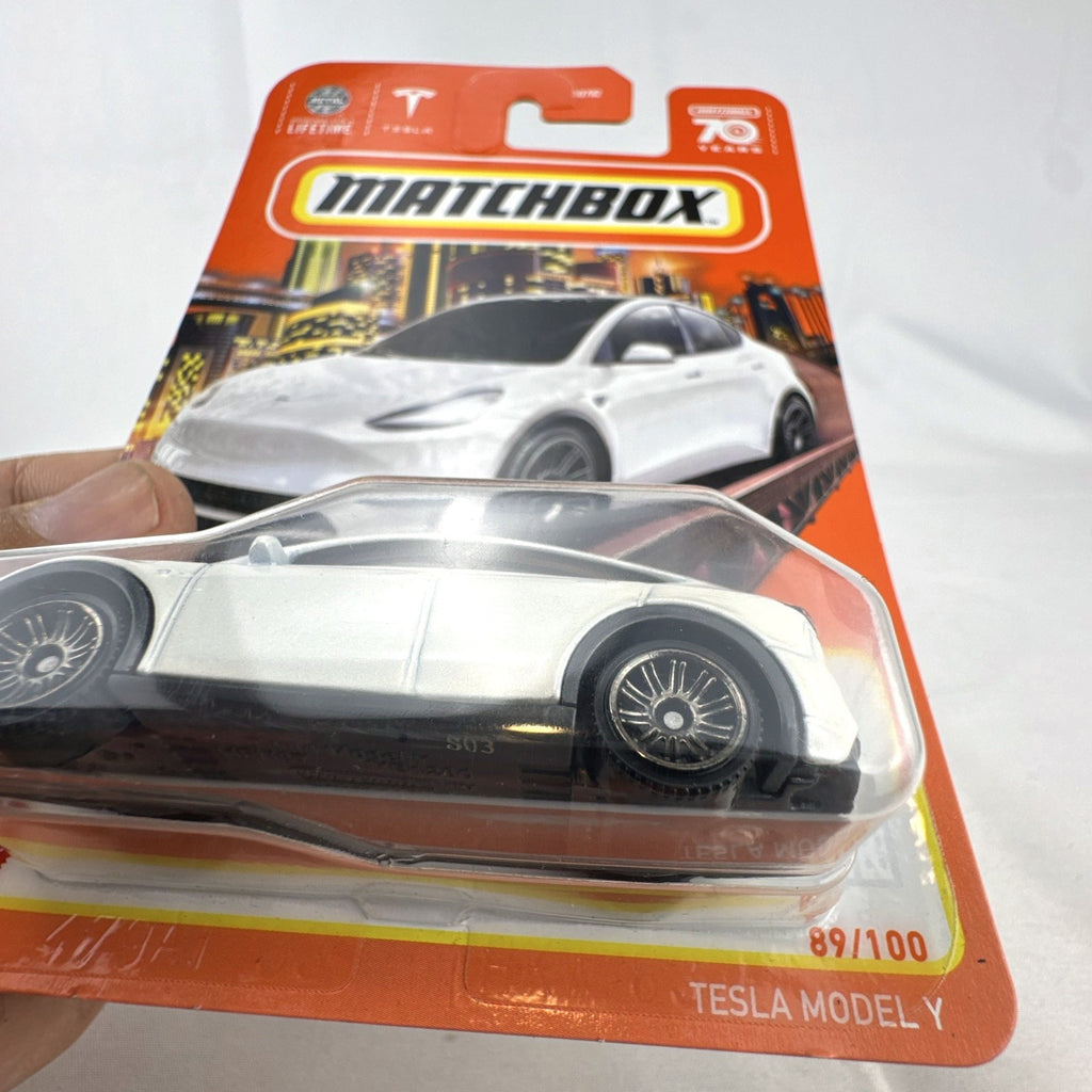 Sealed Matchbox 1:64 scale Tesla Model Y diecast car in white from the 70th Anniversary collection number 89/100