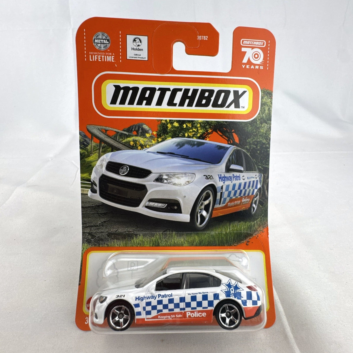 Matchbox 1:64 scale Holden VF Commodore SSV Police Highway Patrol diecast car in white 70th Anniversary packaging