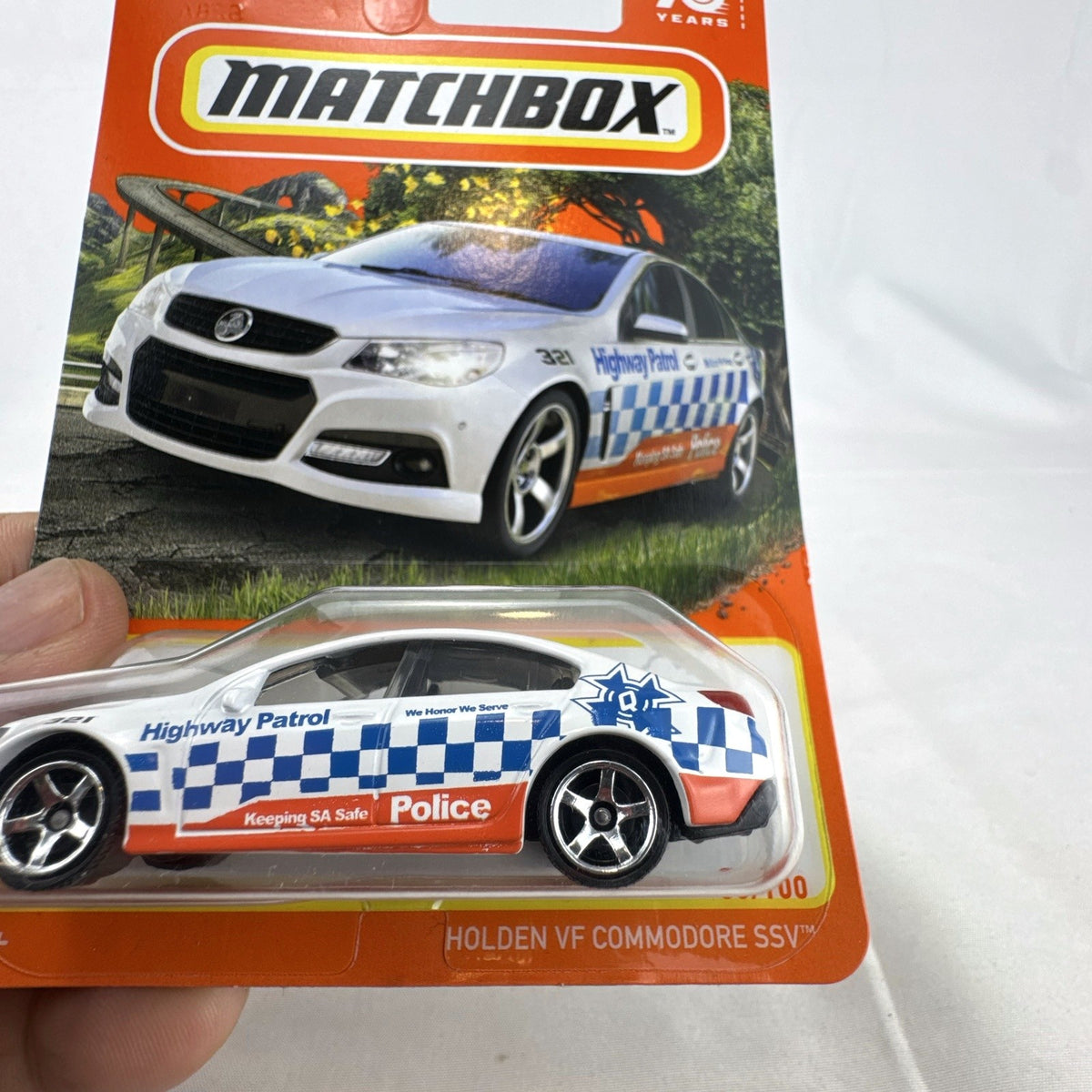 Matchbox 1:64 scale Holden VF Commodore SSV Police Highway Patrol diecast car in white 70th Anniversary packaging