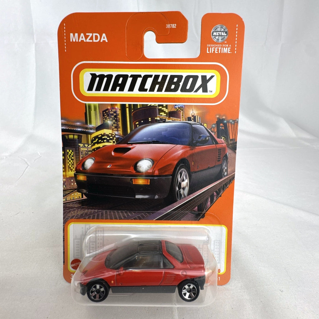 Matchbox 1:64 scale 1992 Mazda Autozam AZ-1 diecast car in red, factory sealed on original blister card