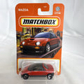 Matchbox 1:64 scale 1992 Mazda Autozam AZ-1 diecast car in red, factory sealed on original blister card