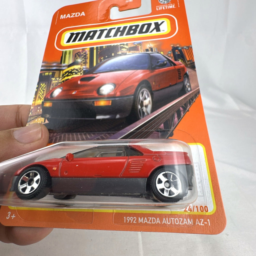 Matchbox 1:64 scale 1992 Mazda Autozam AZ-1 diecast car in red, factory sealed on original blister card