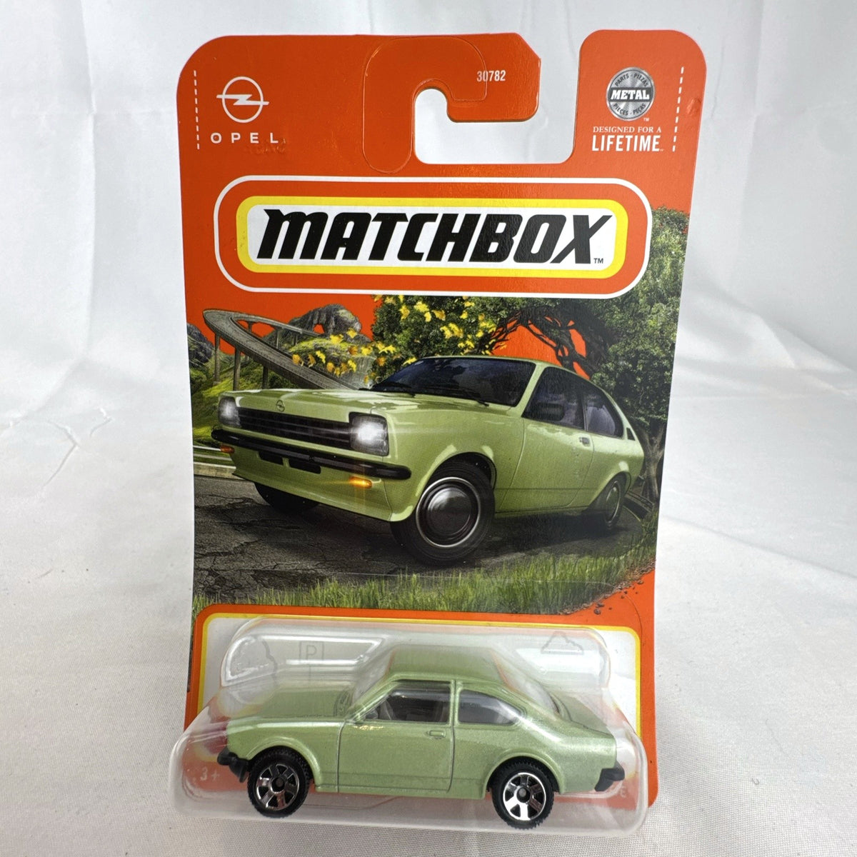 Matchbox 1:64 scale 1975 Opel Kadett C GT/E diecast car in metallic light green, sealed on blister card