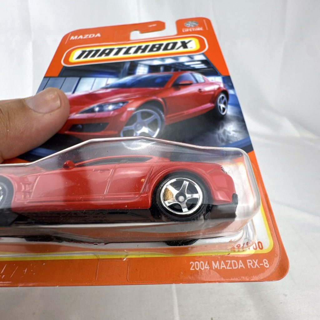 Matchbox 1:64 scale diecast 2004 Mazda RX-8 coupe in red inside factory sealed blister card package