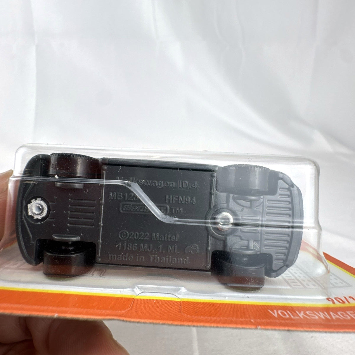 Factory sealed Matchbox 1:64 scale Volkswagen ID.4 diecast electric SUV in white on original packaging card.