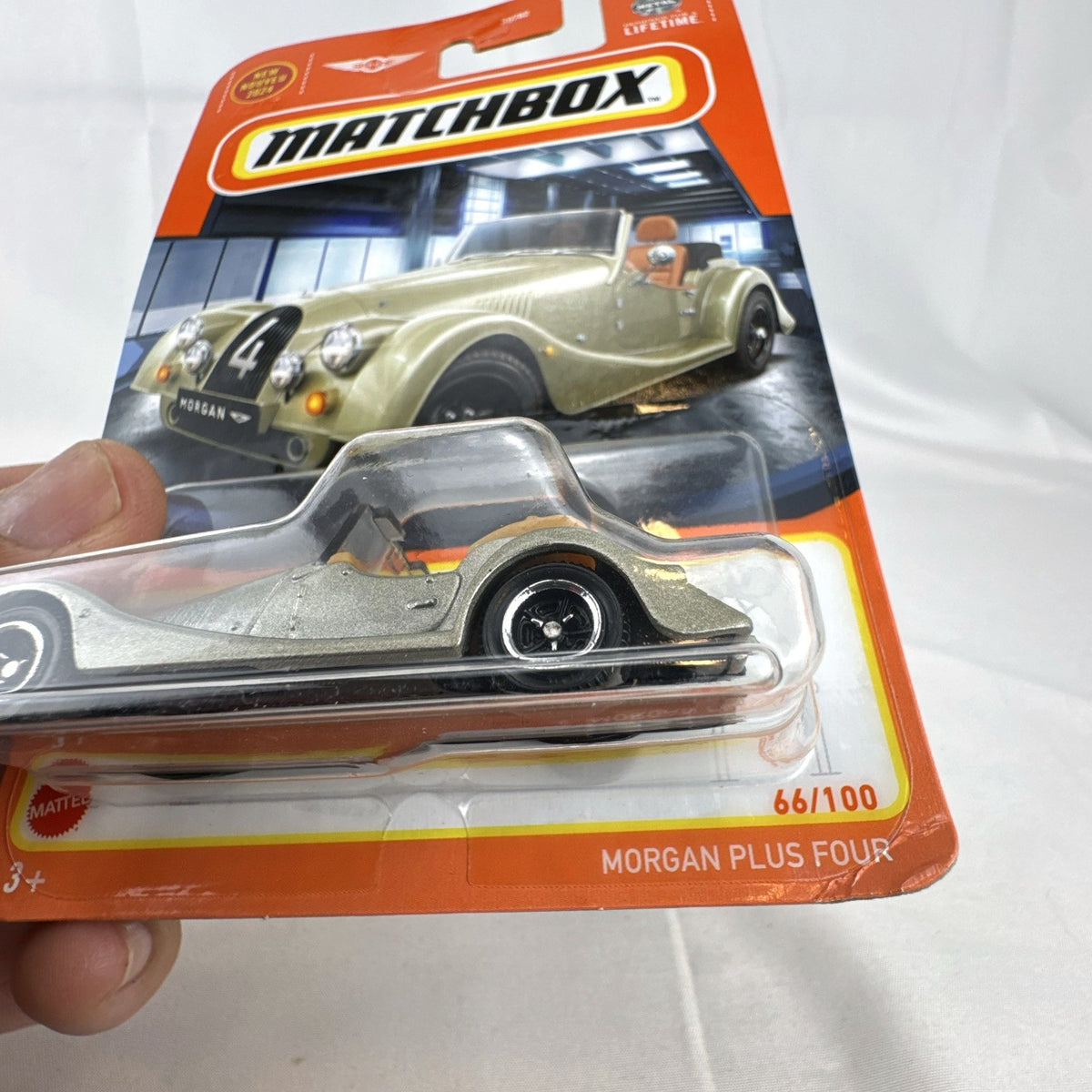 Matchbox 2024 Morgan Plus Four 1:64 scale metallic silver diecast car in factory sealed original card packaging.